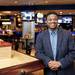 R.U.B. Regional Manager Omar Mitchell poses inside his restaurant on Tuesday, Feb. 5. Mitchell says he tells people the staff is friendly, the atmosphere is sports friendly, and the food is magnificent. Daniel Brenner I AnnArbor.com